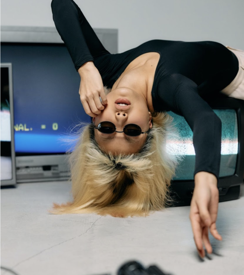 Pexels-Cottonbro Model poses upside down on television